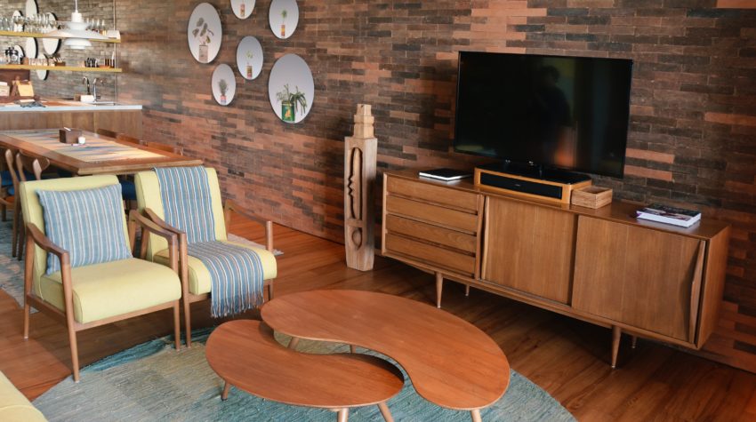 A picture of a living room with typical mid century modern furniture.